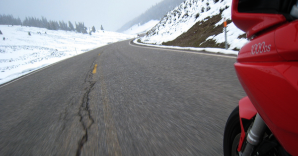 Ducati Multistrada Riding over a mountain in the snow