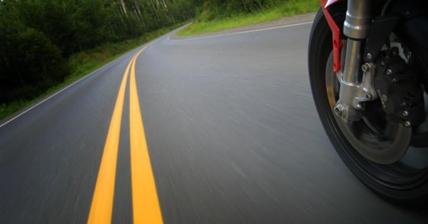 motorcycle trail braking into a corner