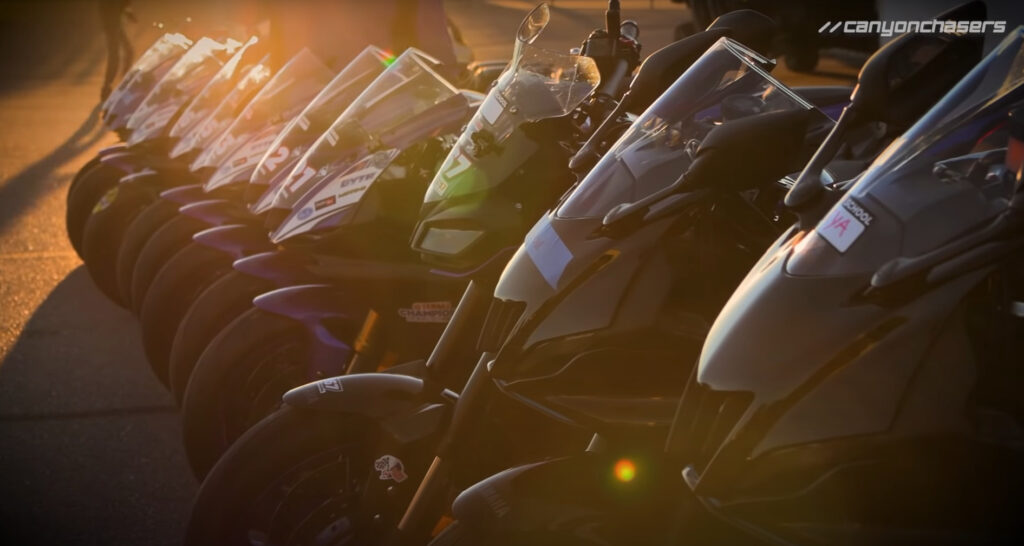 Yamaha motorcycles lined up at sunrise