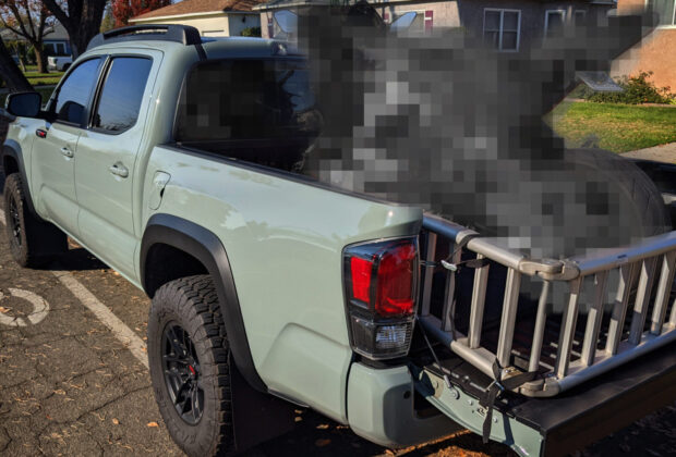 Mystery Motorcycle in the back of a Toyota Tacoma Picup