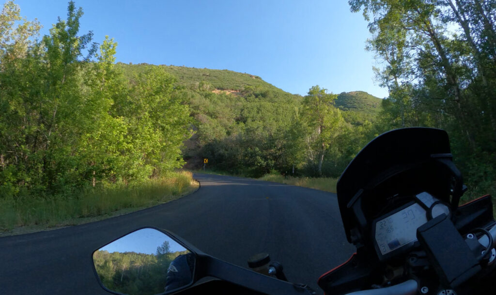 Motorcycle riding a corner in a canyon