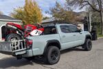 motorcycle in the back of a toyota tacoma