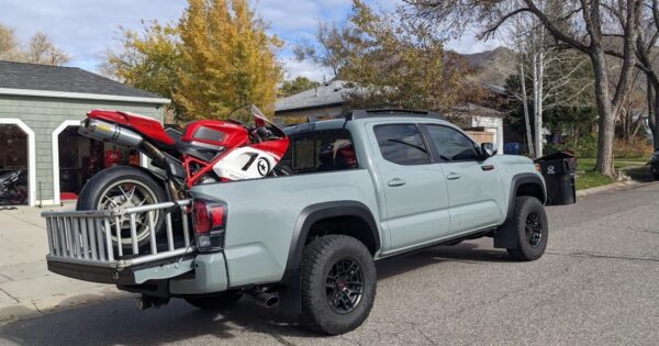 motorcycle in the back of a toyota tacoma