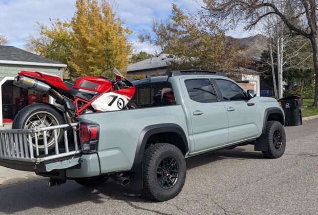 motorcycle in the back of a toyota tacoma