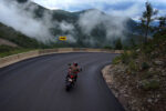 motorcycle riding a steep downhill corner