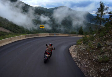 motorcycle riding a steep downhill corner