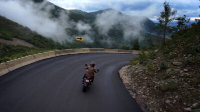 motorcycle riding a steep downhill corner