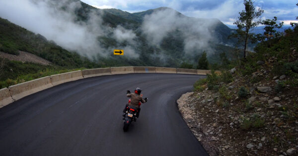 motorcycle riding a steep downhill corner