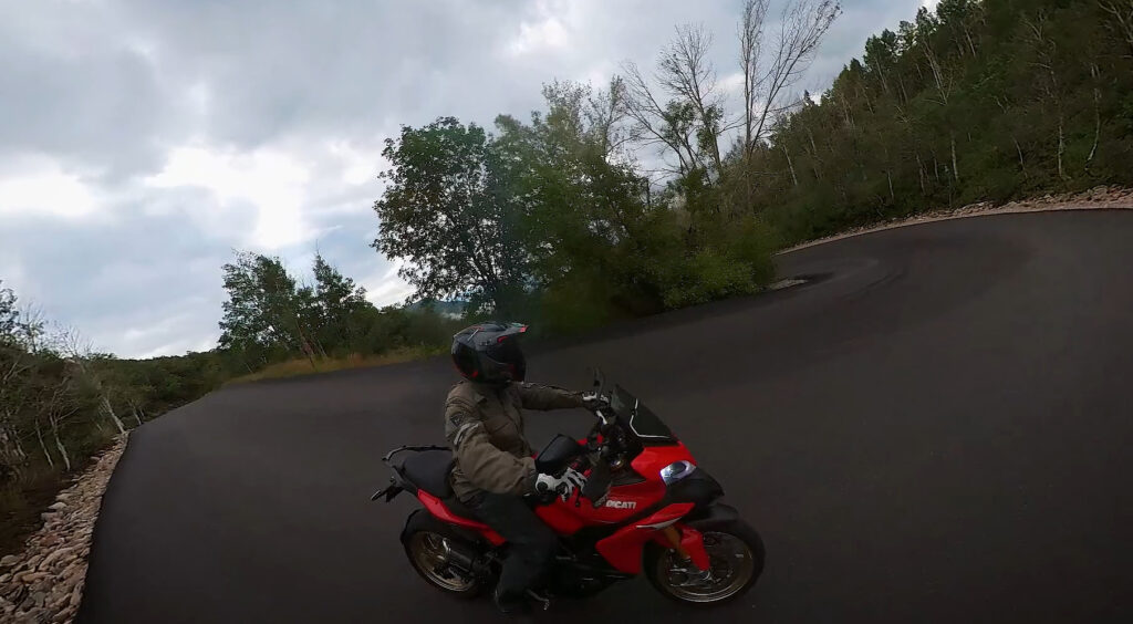 Ducati multistrada riding down a steep downhill corner