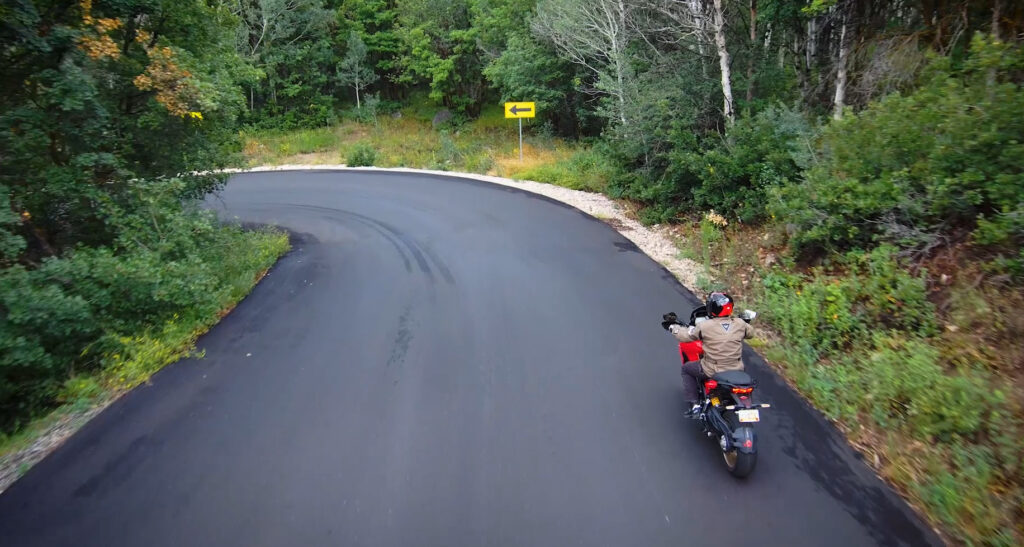 ducati multistrada motorcycle trail braking through a downhill corner