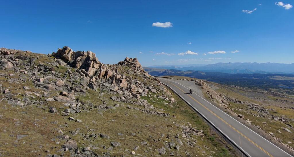 motorcycle entering blind corner on beartooth highway