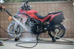 Washing a motorcycle in the driveway