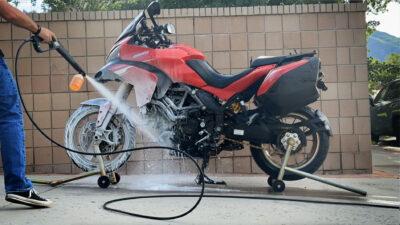 Washing a motorcycle in the driveway