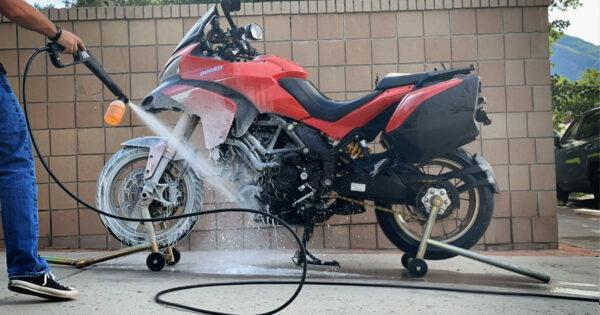 Washing a motorcycle in the driveway