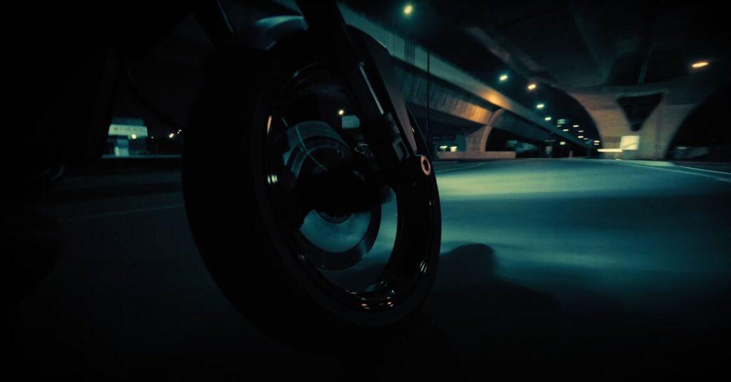 motorcycle front tire riding in the dark dramatic light