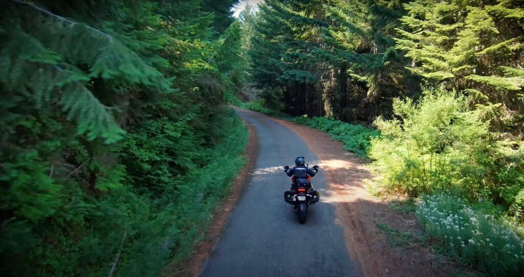 Motorcycle riding narrow, dirty road in Oregon