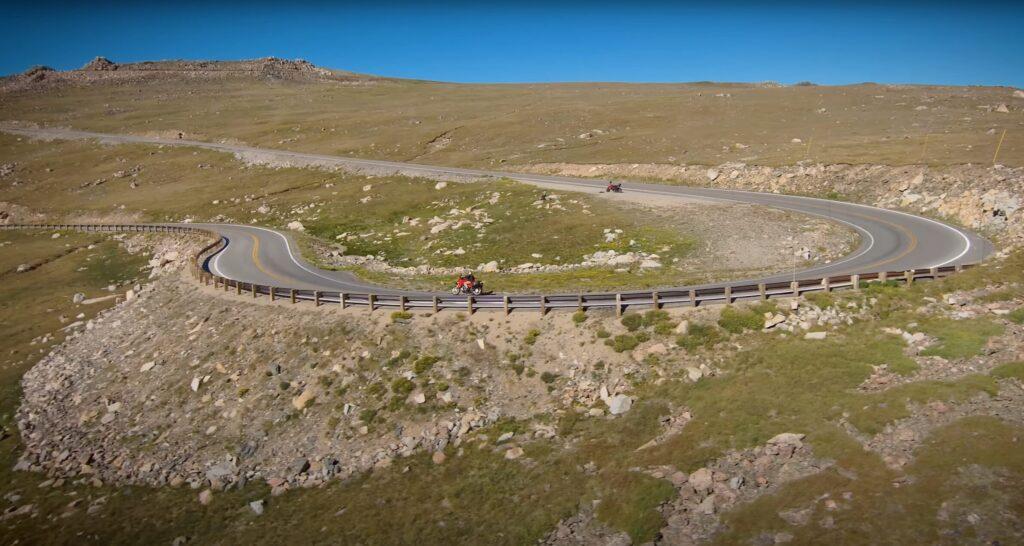 Motorcycle riding through a corner on Bear Tooth Pass in Wyoming