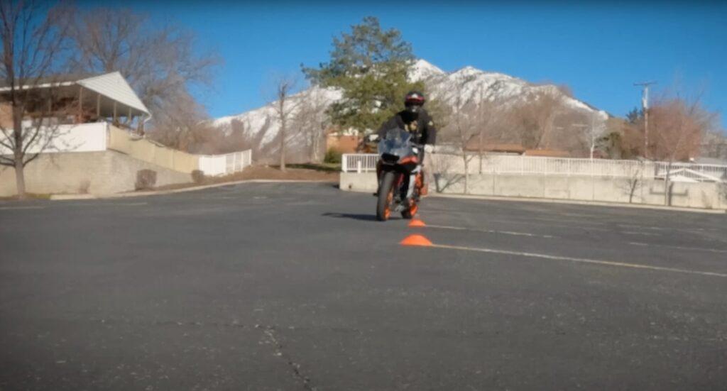 Motorcycle weaving through cones