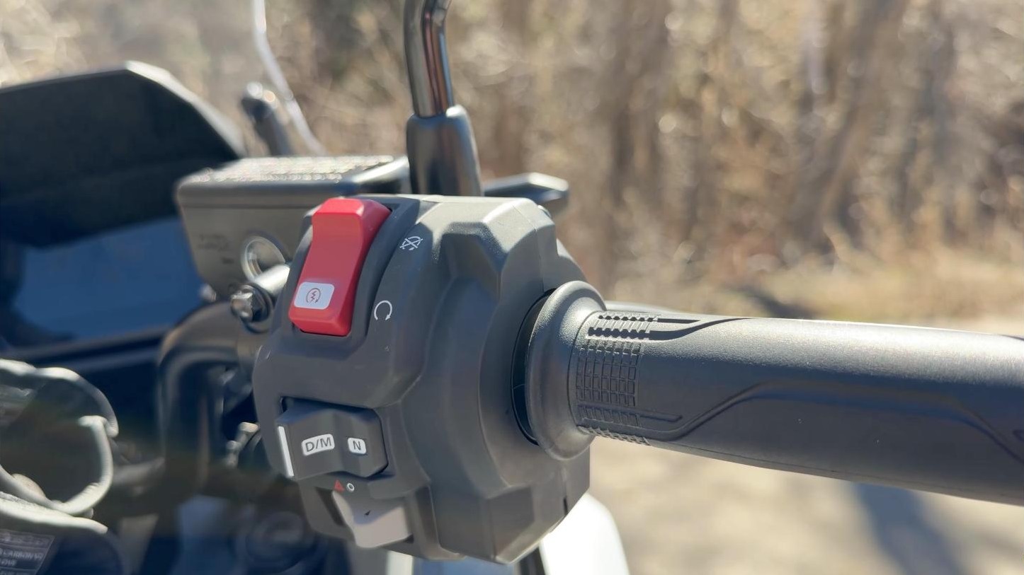 The Honda NC750X DCT controls on the handlebar, showing the D/M and N buttons
