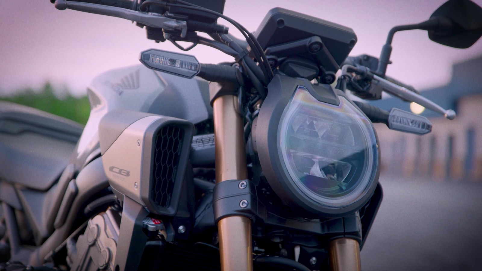 Close detail of the Honda CB650R slanted LED headlight and side air scoops