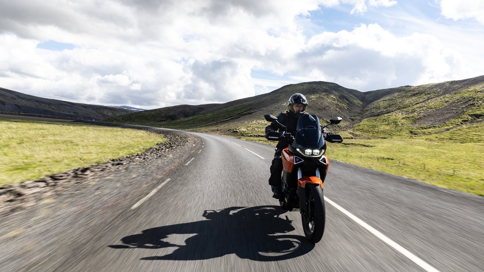 2026 Norton Atlas adventure bike riding toward the camera on an open road in Iceland