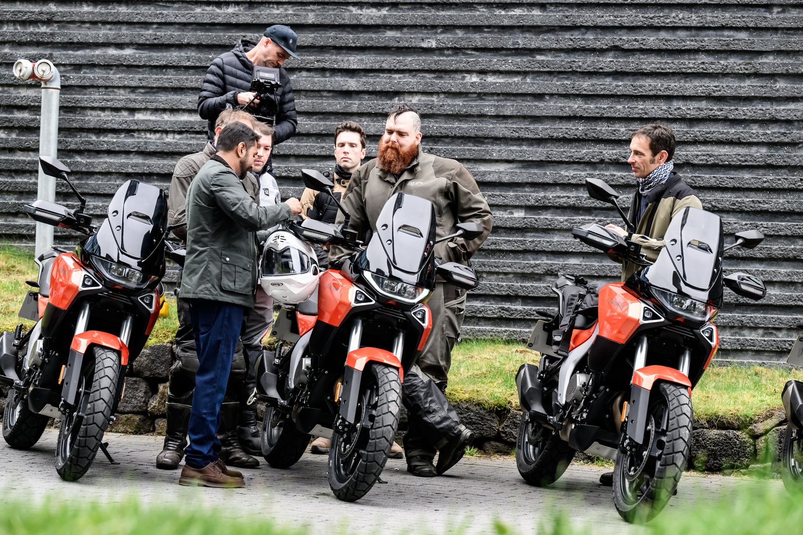 Three 2026 Norton Atlas motorcycles lined up with the launch crew in Iceland