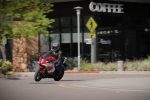 2026 Yamaha R7 riding through town, three-quarter front view