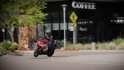 2026 Yamaha R7 riding through town, three-quarter front view