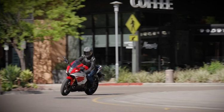 2026 Yamaha R7 riding through town, three-quarter front view