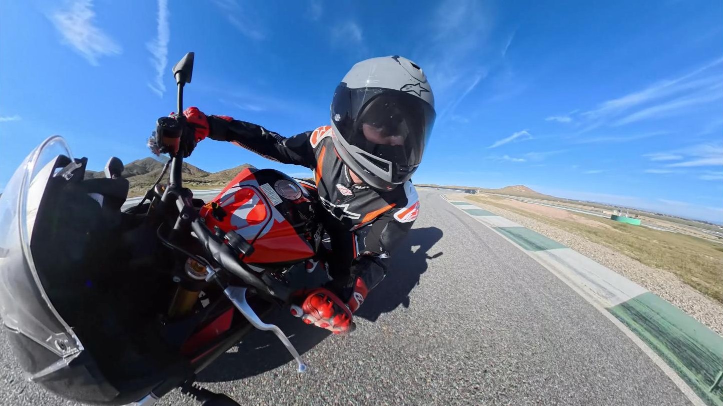 Riding the Alpinestars Supertech R7 on track, leaned over through a corner
