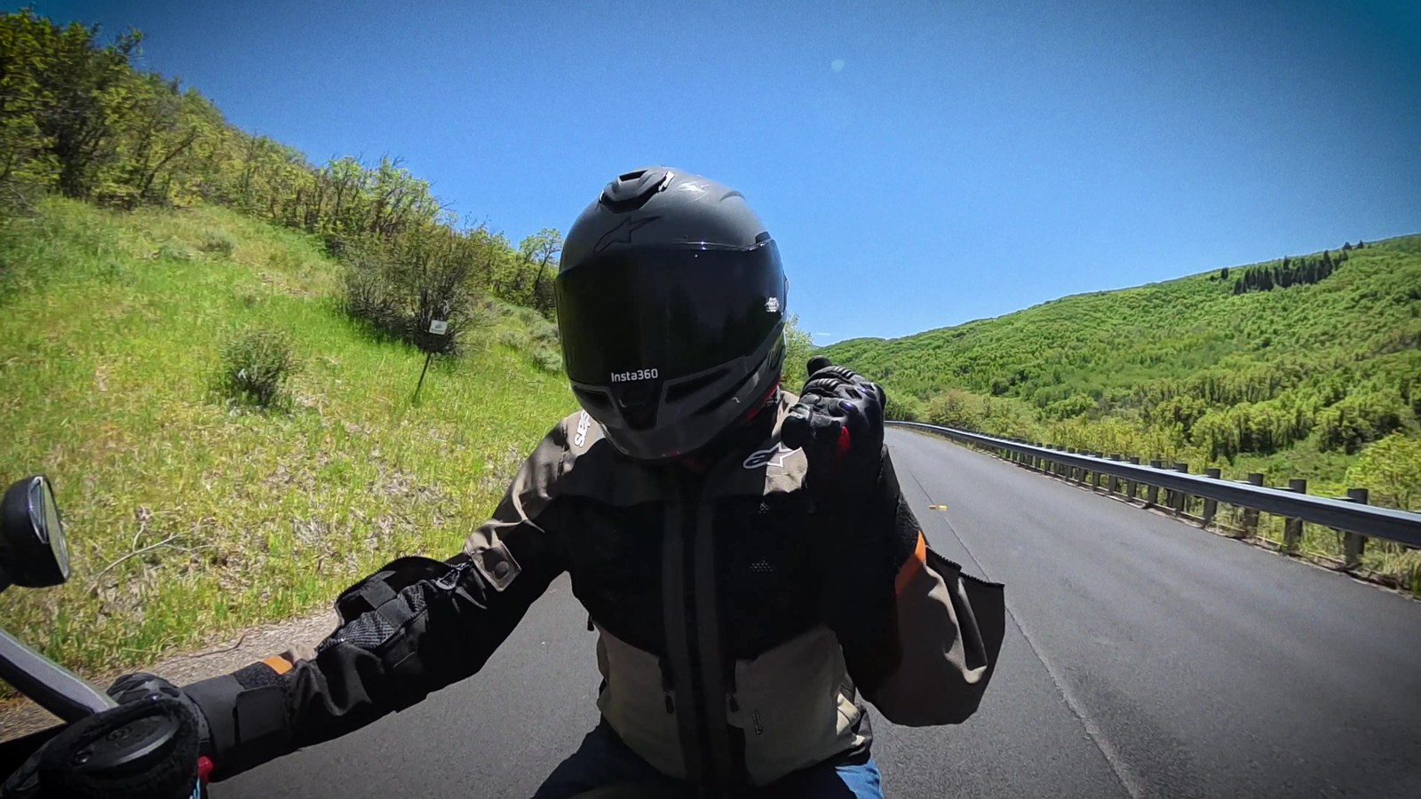 Point-of-view shot riding a motorcycle on an open canyon road