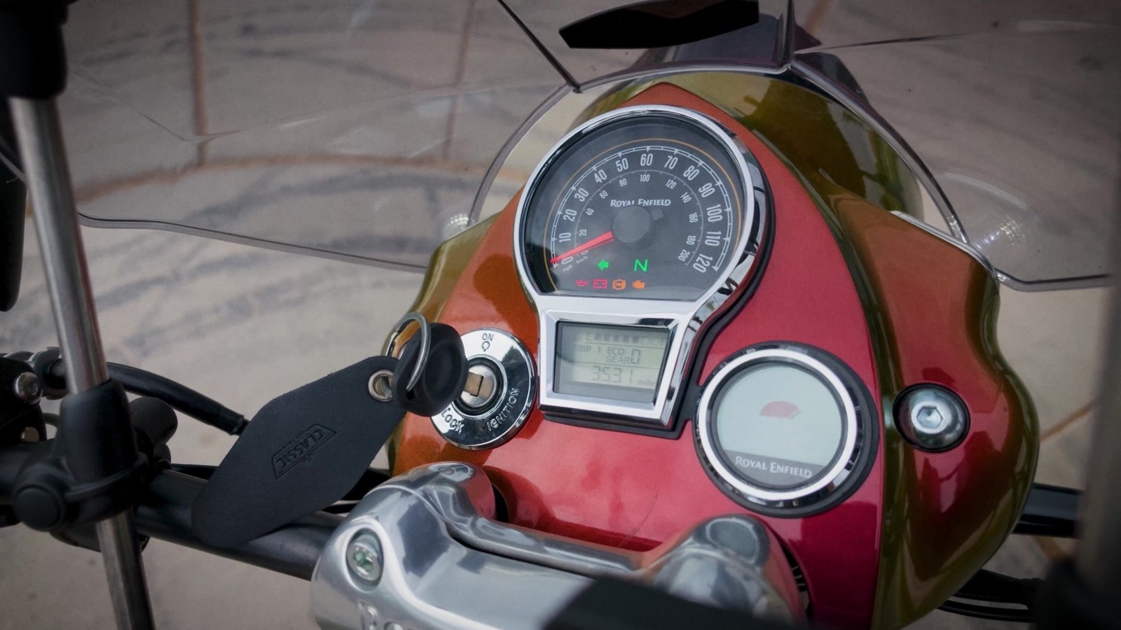 One analog dial for speed, one small fuel gauge, and that is the entire dashboard.
