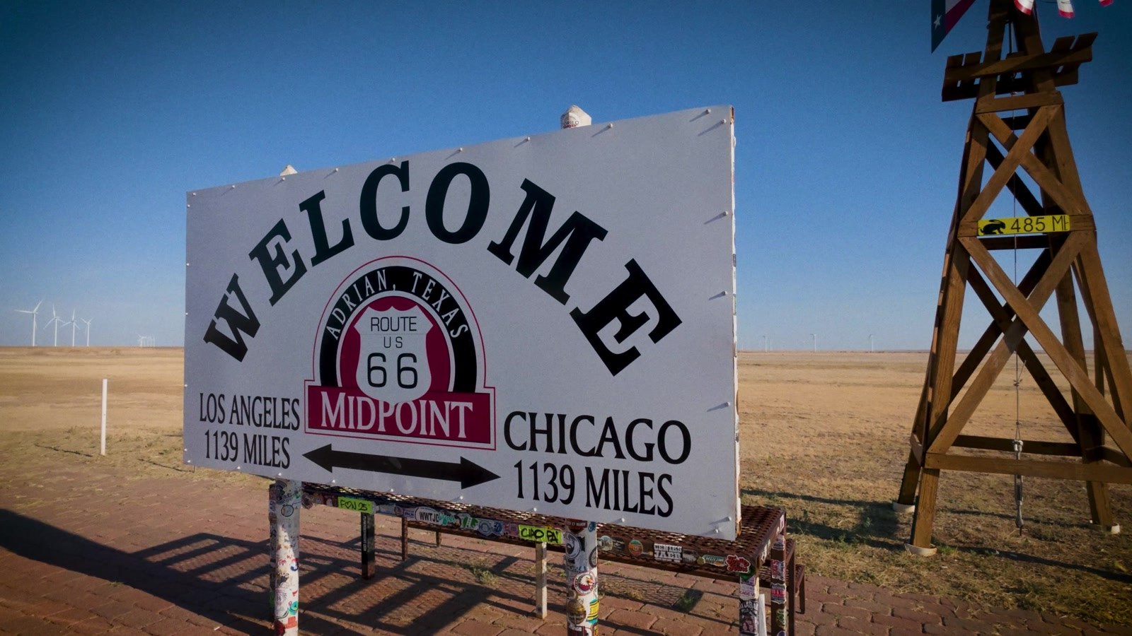 The Midpoint sign, Adrian, Texas. Exactly as accurate as the road it is measuring.