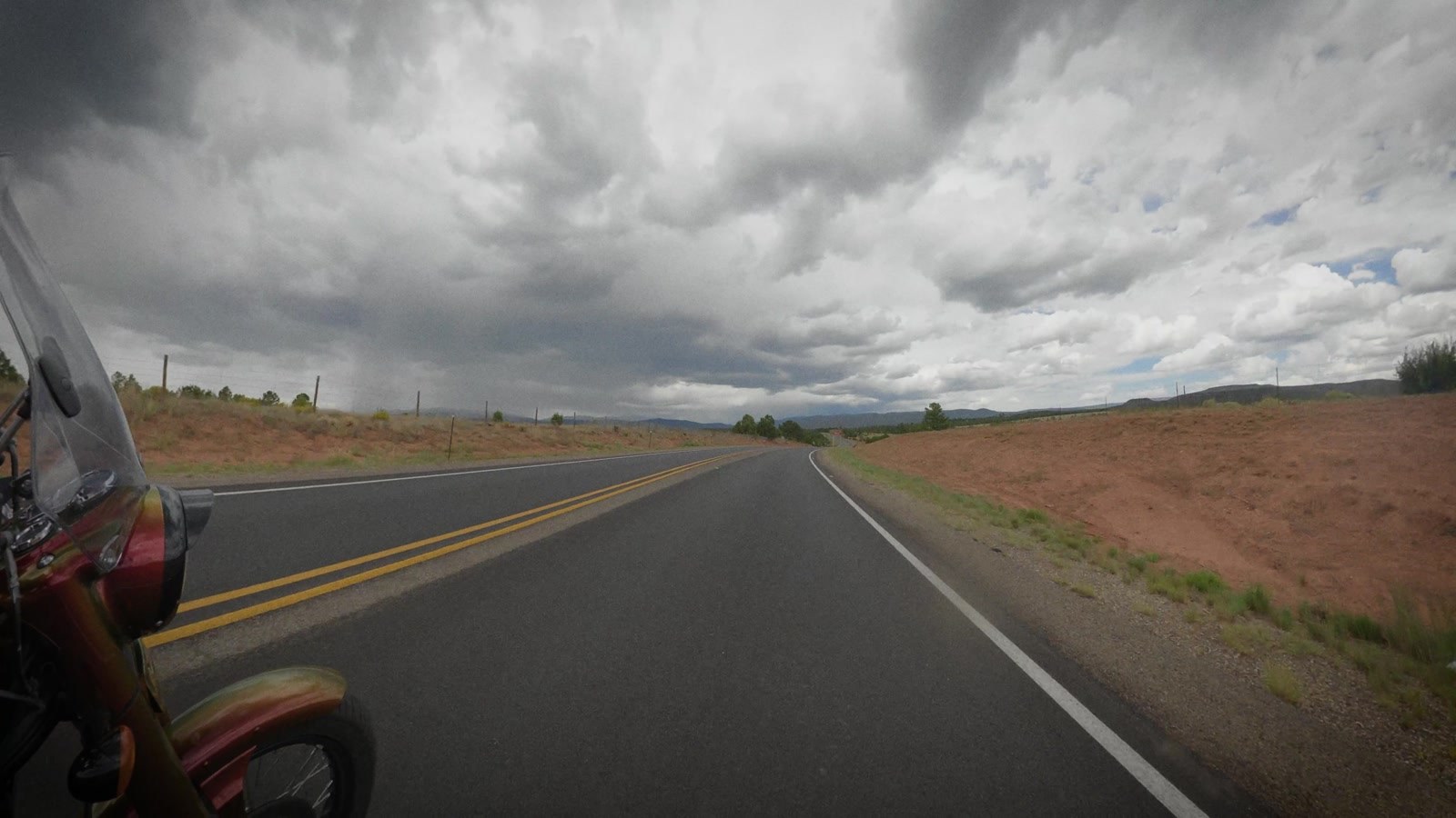 Two days of straight, flat and hot, and then clouds with shape to them and a road that goes up.