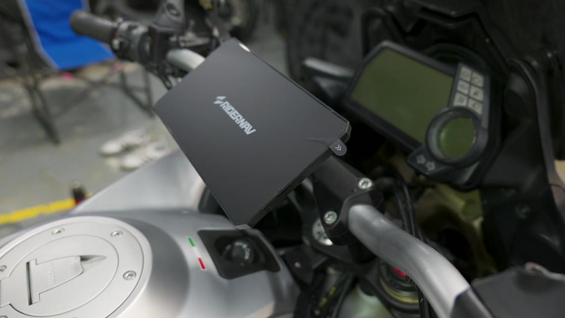 One button and the R7X lifts off the cradle. Gas stop, lunch stop, it goes in your pocket
