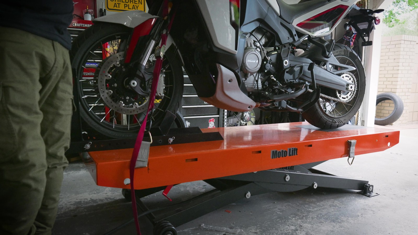 Moto Morini X-Cape 1200 on a lift for its first oil change