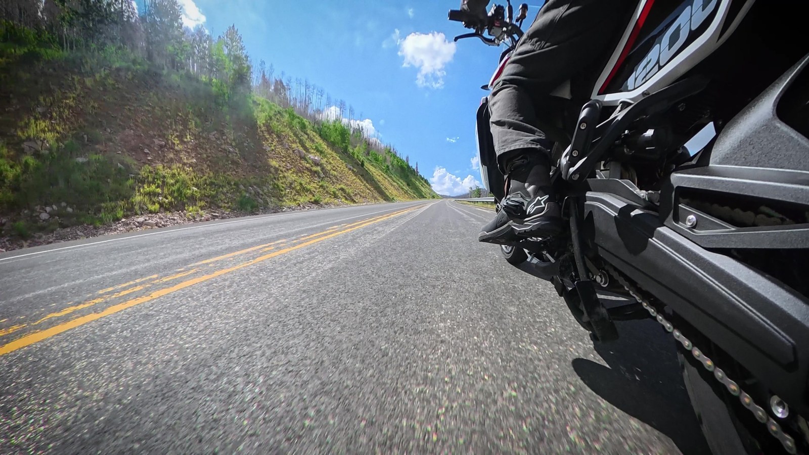 Onboard view of the X-Cape 1200 leaned over on a canyon road