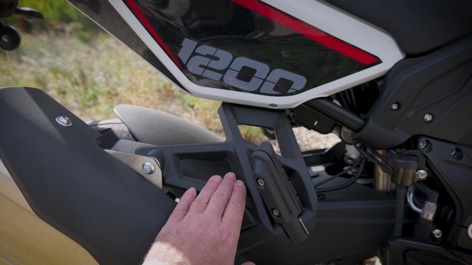Side panel vent on the X-Cape 1200 that directs engine heat at the rider's knees