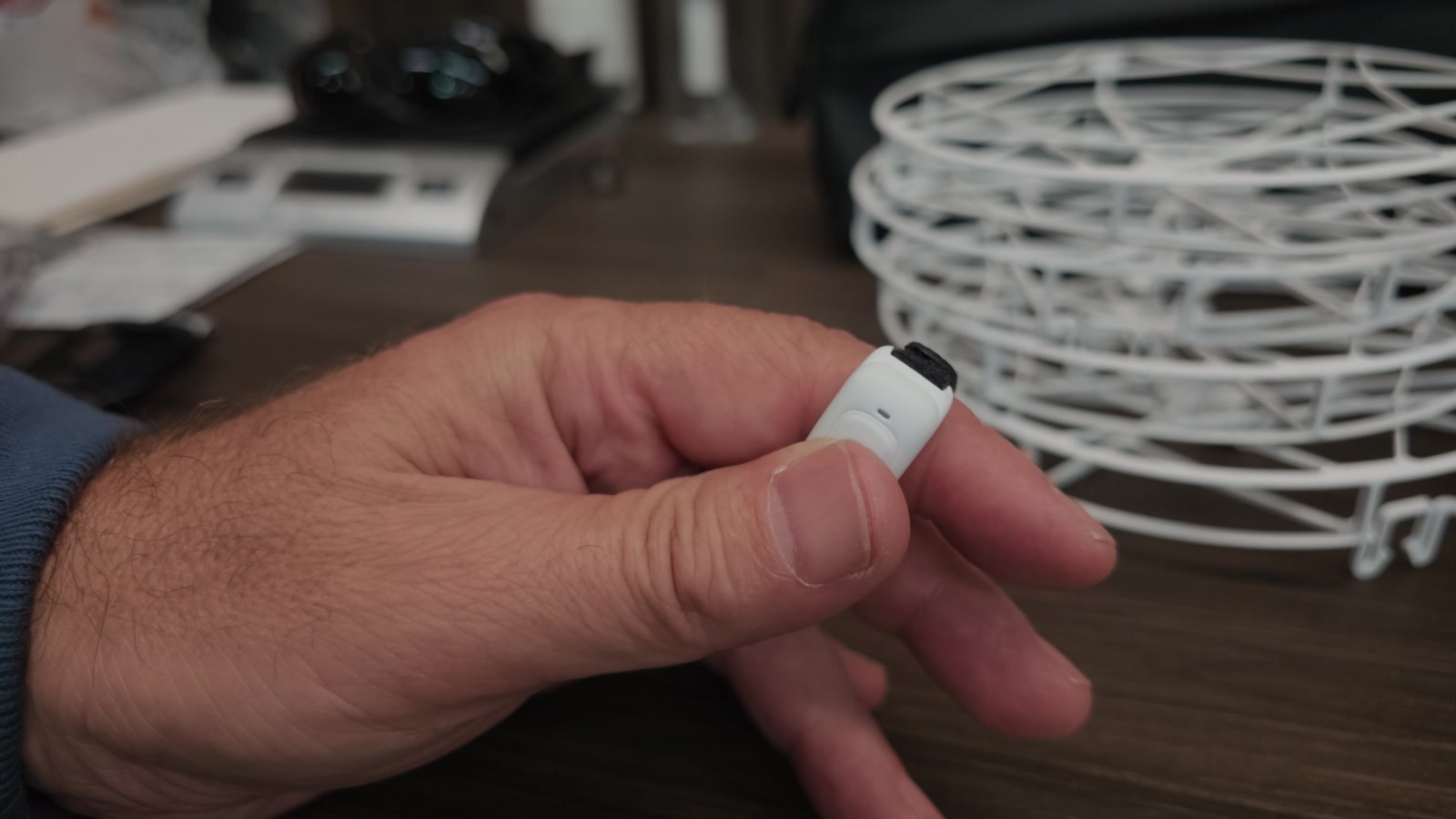 The Ring Remote. Hold the button, move your hand, and the drone follows it.