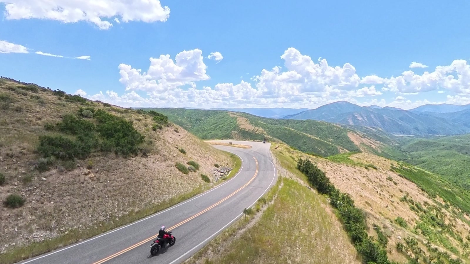 My go-to: a three-quarter forward angle, in sight and off the road.