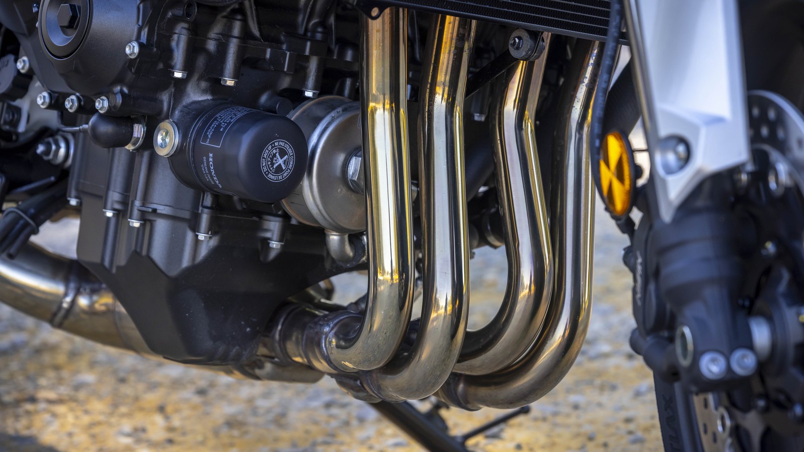 Chrome headers feed a megaphone-style muffler.