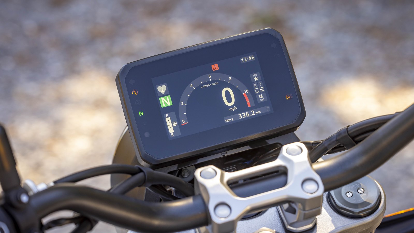 The one aesthetic miss: a Transalp-style TFT where two round dials belong.