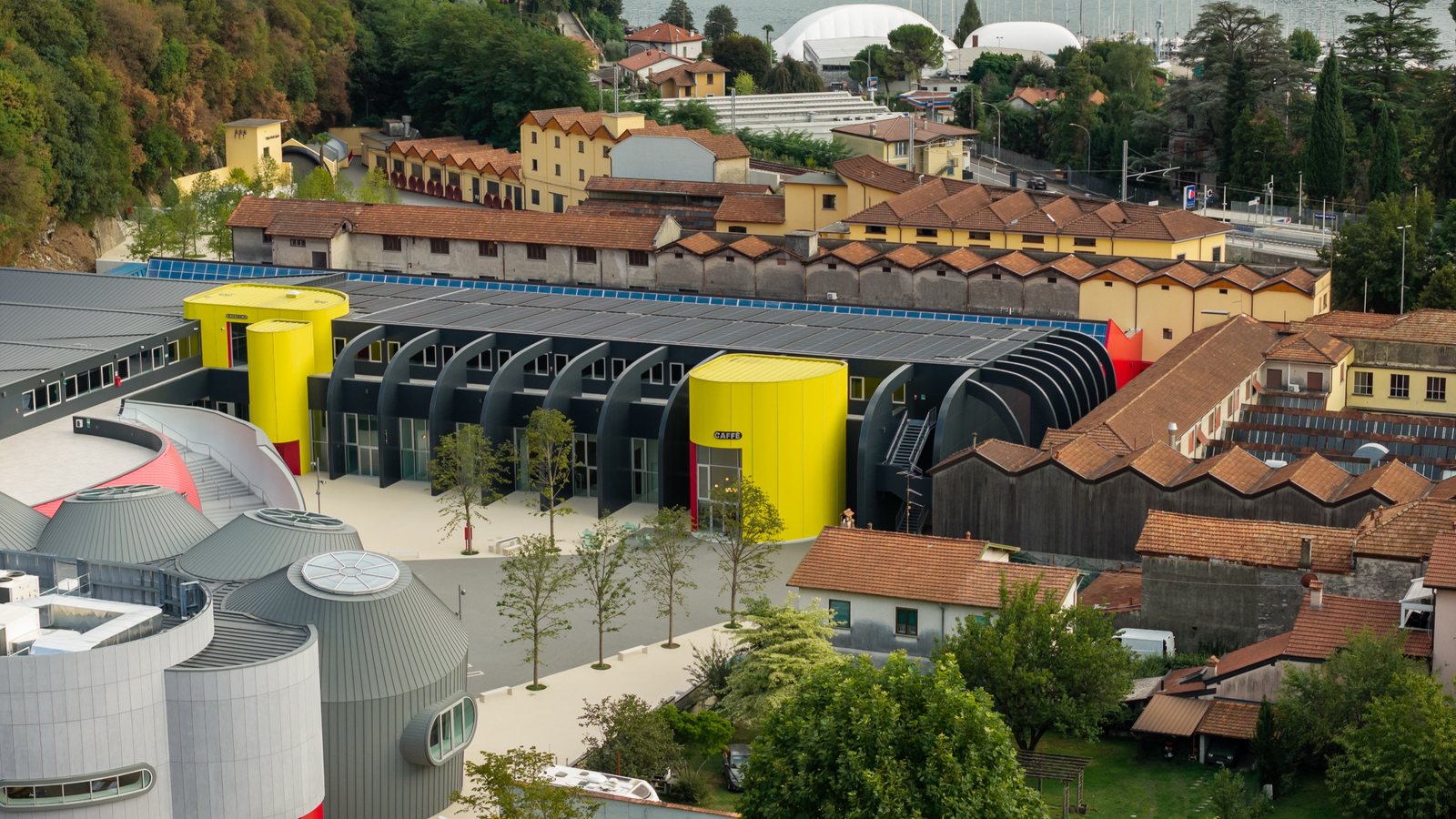 Aerial view of the Moto Guzzi factory site with Lake Como in the background