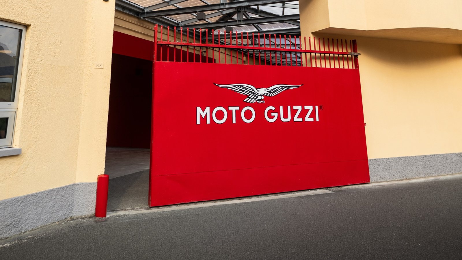 The red Moto Guzzi factory gate on Via Parodi in Mandello del Lario