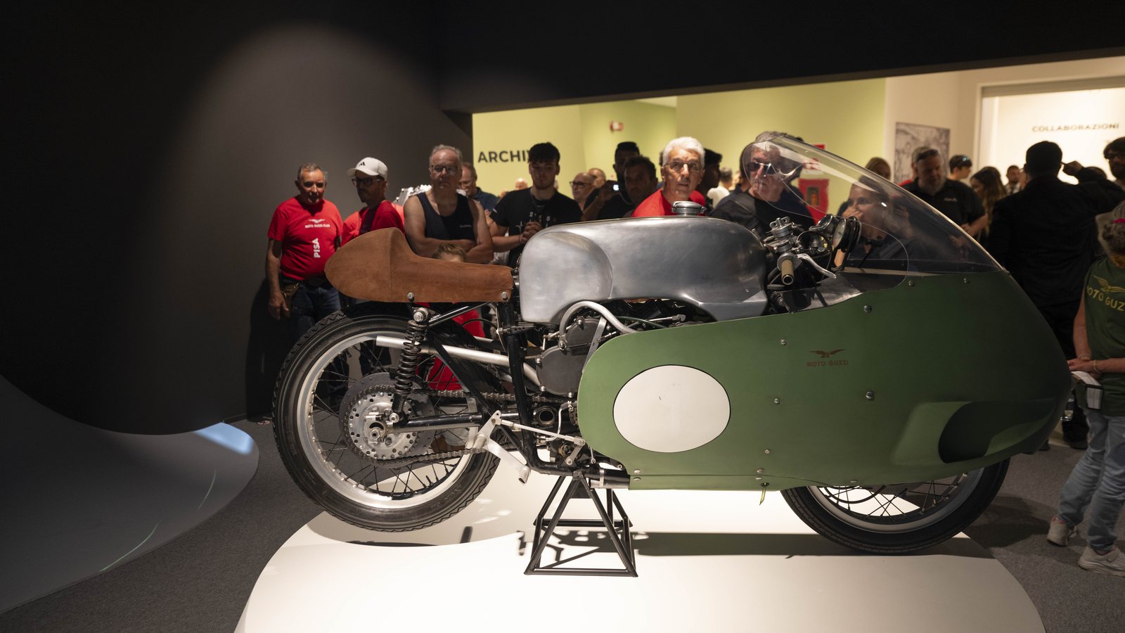 A 1950s Moto Guzzi Grand Prix racer with a full dustbin fairing on display
