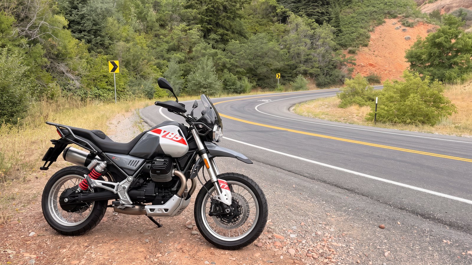 The 2027 Moto Guzzi V85 TT giveaway bike parked beside a canyon road in Utah