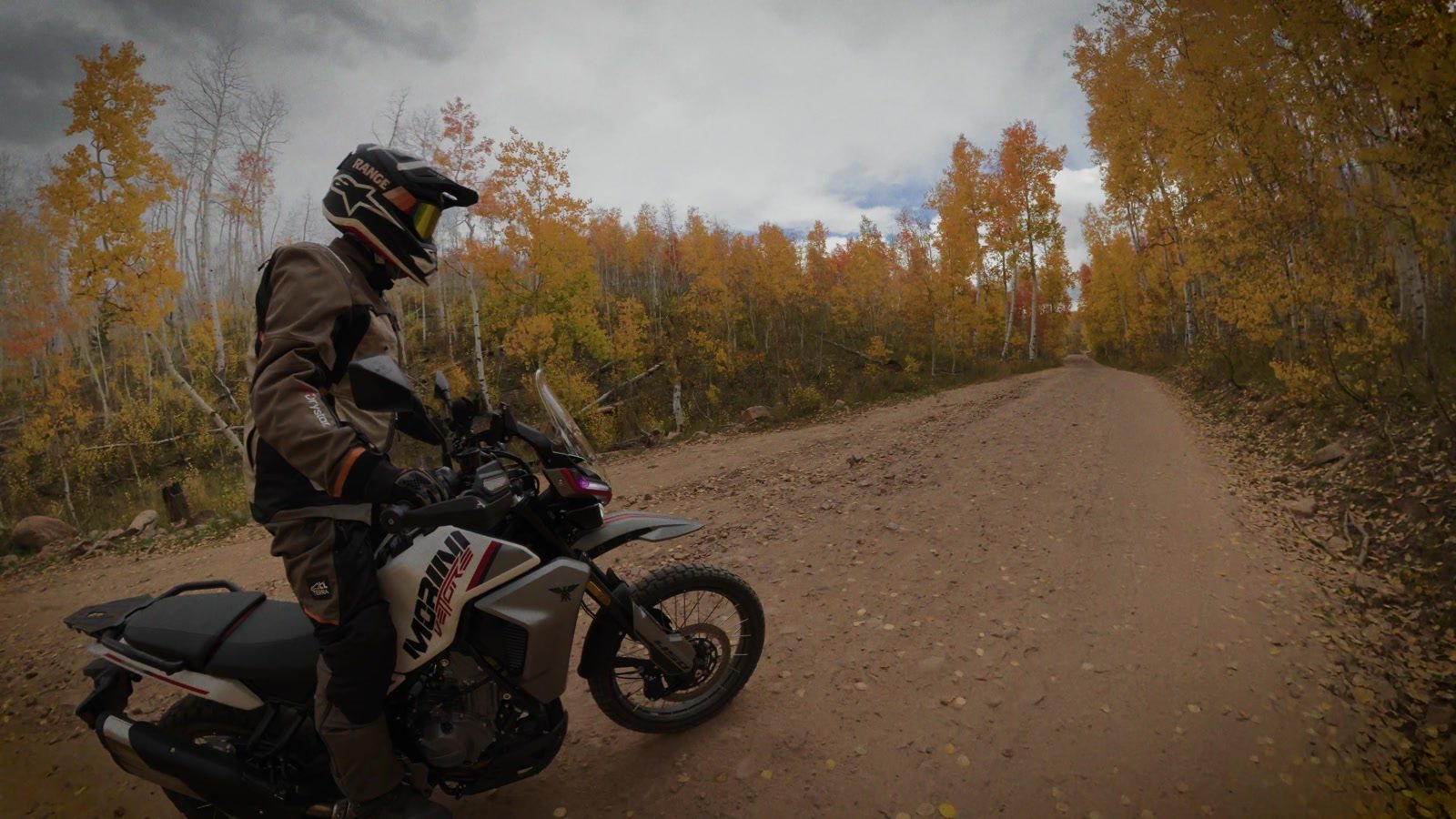 Rider on the Moto Morini Vettore 450 on a loose dirt road in the aspens