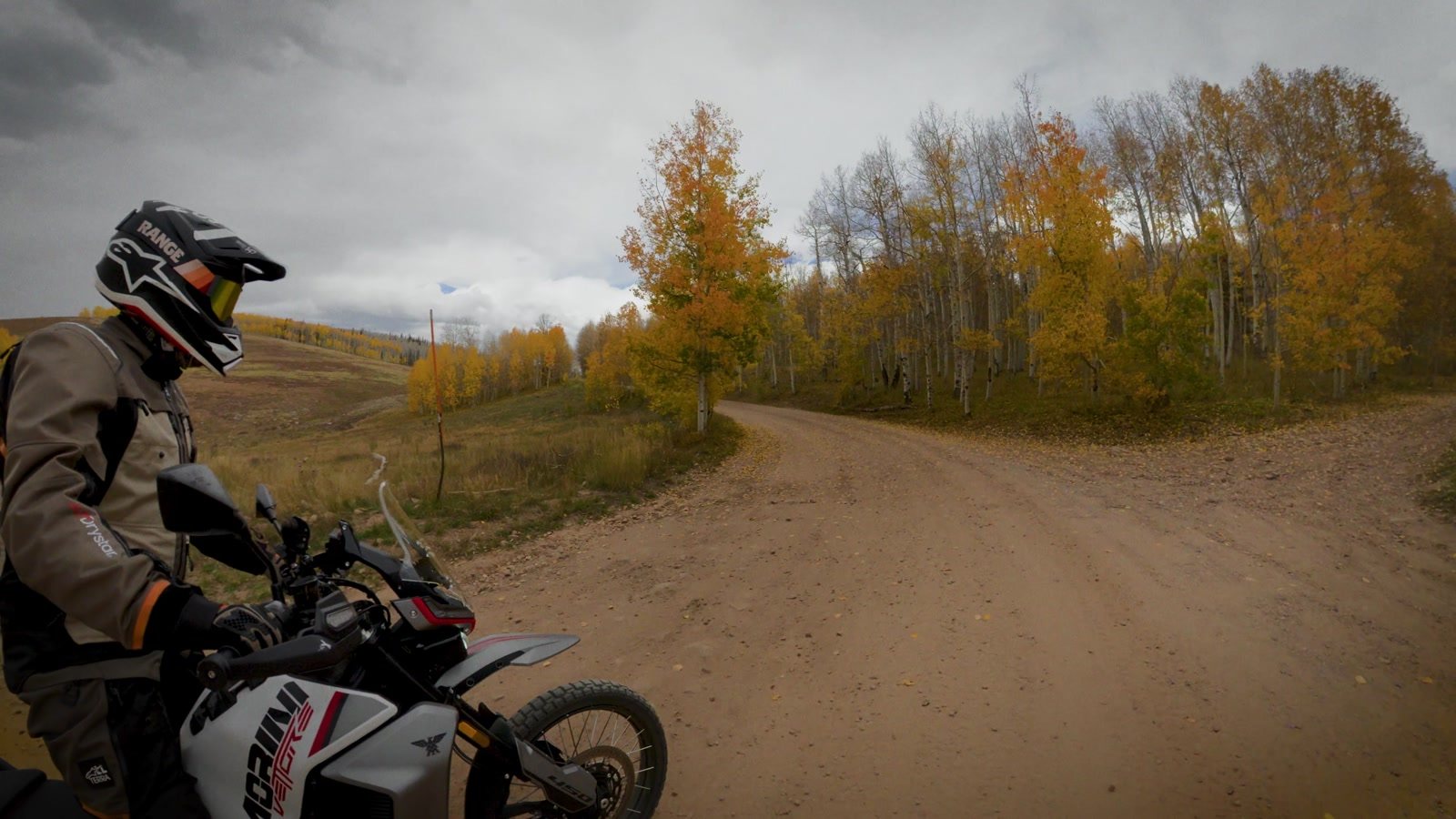 Rider on the Moto Morini Vettore 450 at a junction of dirt roads among fall aspens in northern Utah